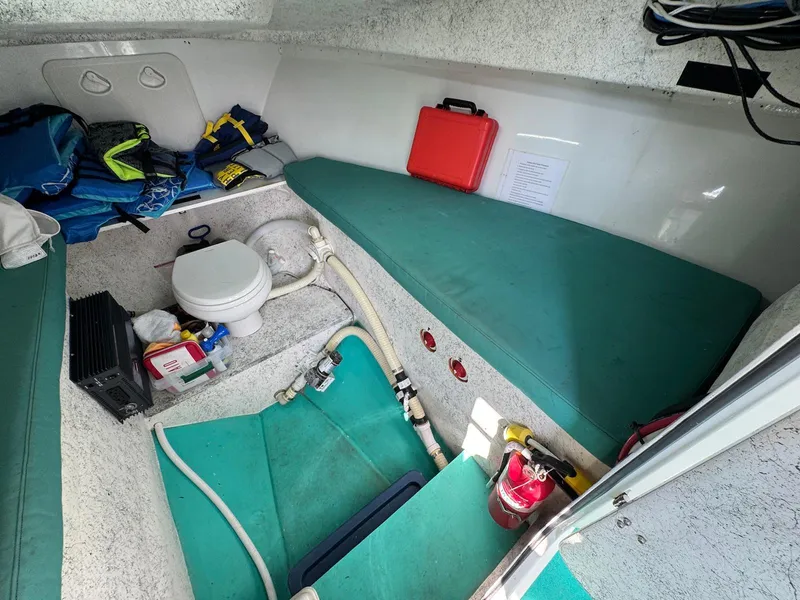 Slide: The Image of Interior of 2018 Custom Ocean Master boat with toilet, seating, and safety equipment. - 20