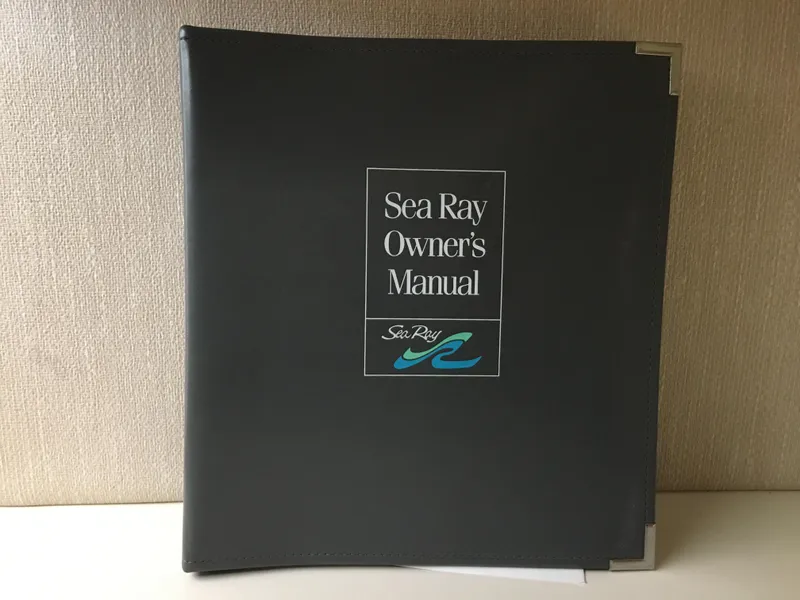 Slide: The Image of Sea Ray 400 Express Cruiser 1996 owner's manual in black cover. - 33
