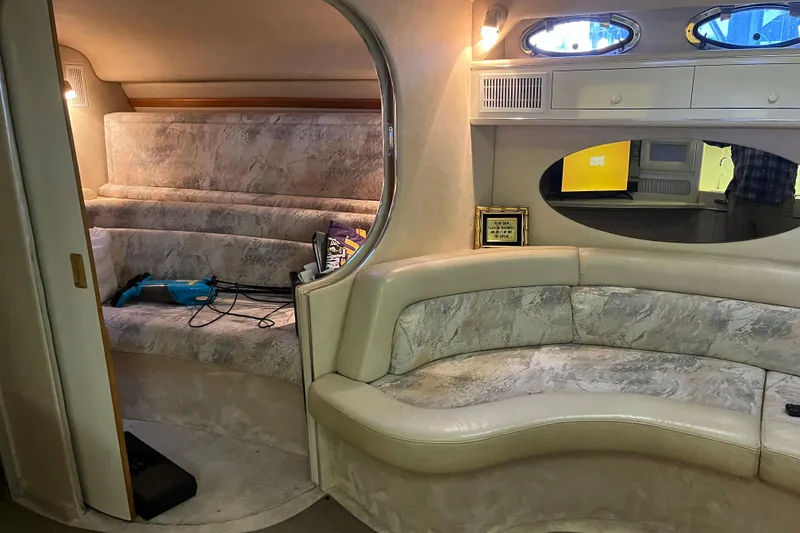 Slide: The Image of Interior of a 1996 Sea Ray 400 Express Cruiser with plush seating and modern amenities. - 39