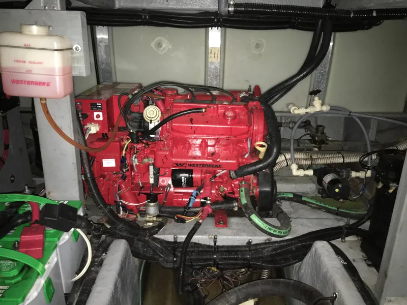 Slide: The Image of Engine room of a 1996 Sea Ray 400 Express Cruiser with a red Westerbeke generator. - 7