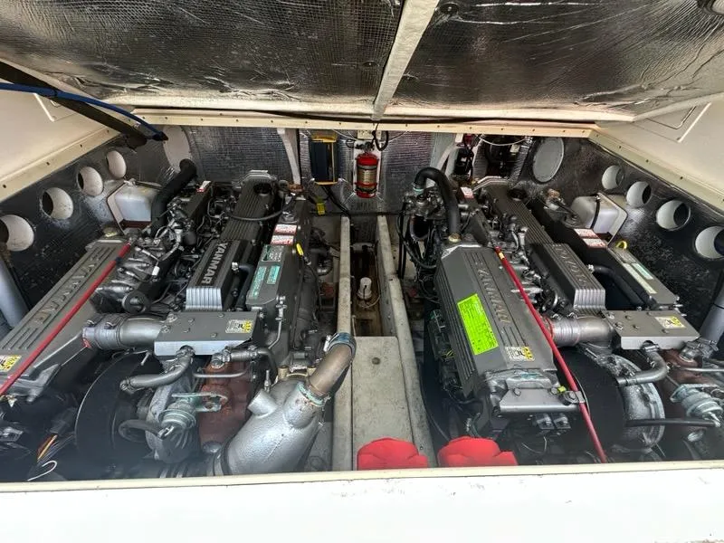 Slide: The Image of Engine compartment of a 2005 Carolina Classic 28 boat, featuring dual Yanmar engines. - 20