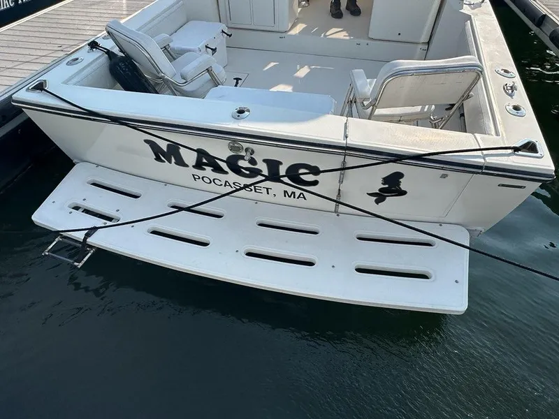 Slide: The Image of 2005 Carolina Classic 28 boat named "Magic" docked in Pocasset, MA. - 4
