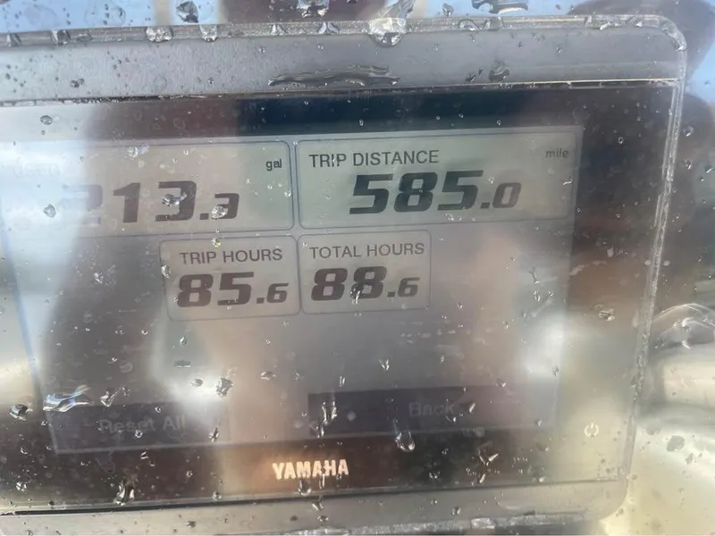 Slide: The Image of Display screen on 2021 Cobia 220 Center Console showing trip data and Yamaha branding. - 11