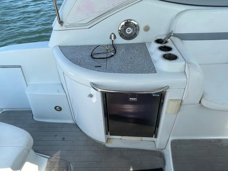 Slide: The Image of 2008 Formula 31 PC boat interior with countertop, cup holders, and mini fridge. - 10