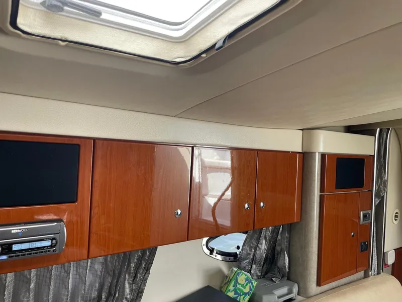 Slide: The Image of Interior of a 2008 Formula 31 PC boat with wood cabinets and a skylight. - 14