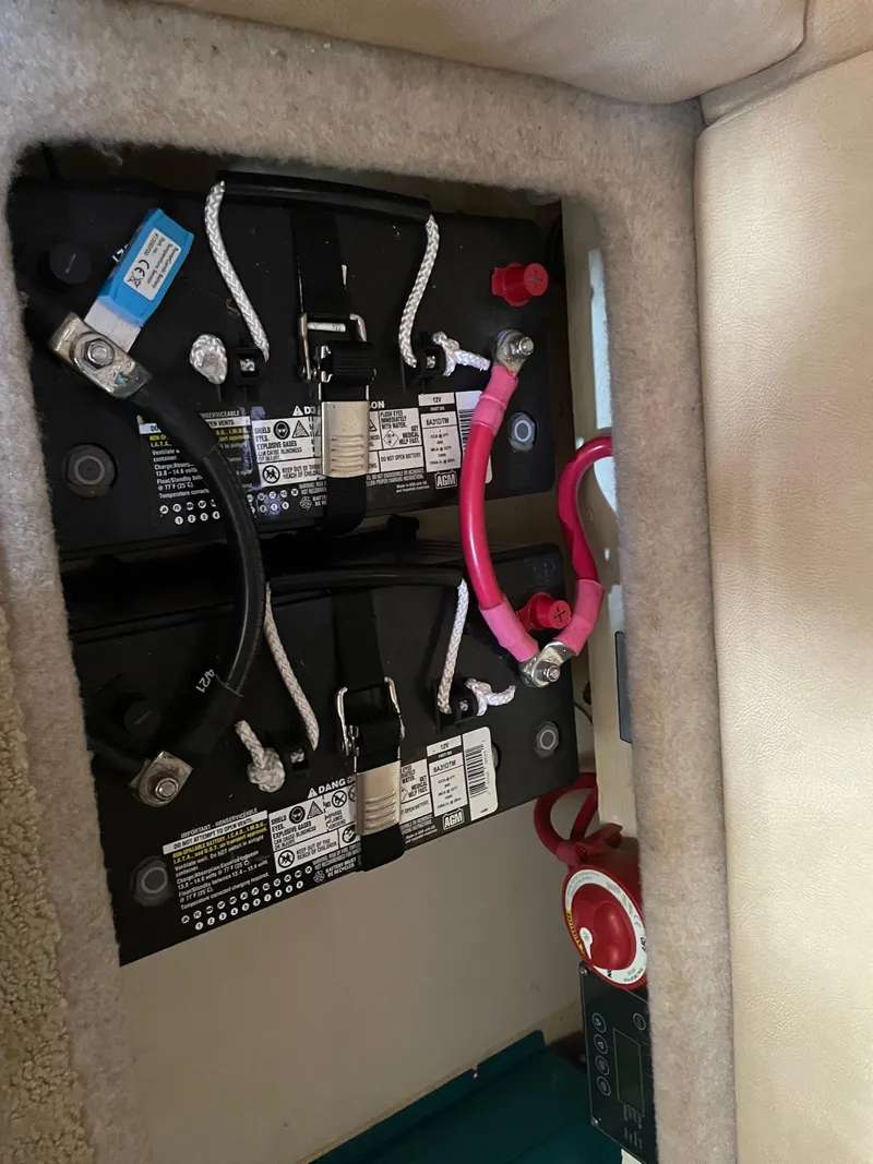Slide: The Image of 2008 Formula 31 PC boat battery compartment with wiring and connections. - 23