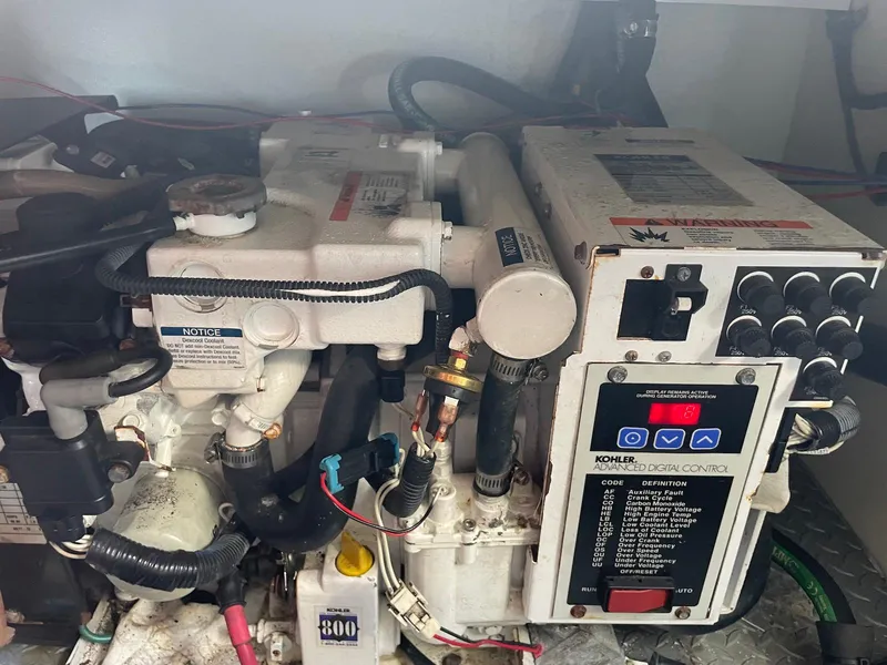 Slide: The Image of Engine compartment of a 2008 Formula 31 PC boat with Kohler digital control panel. - 24