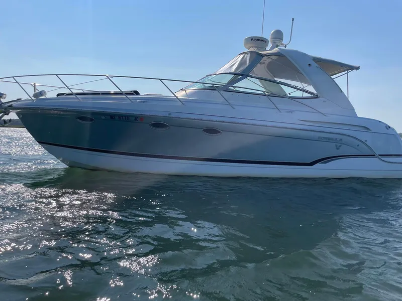 Slide: The Image of 2008 Formula 31 PC boat on water, side view, clear sky background. - 3