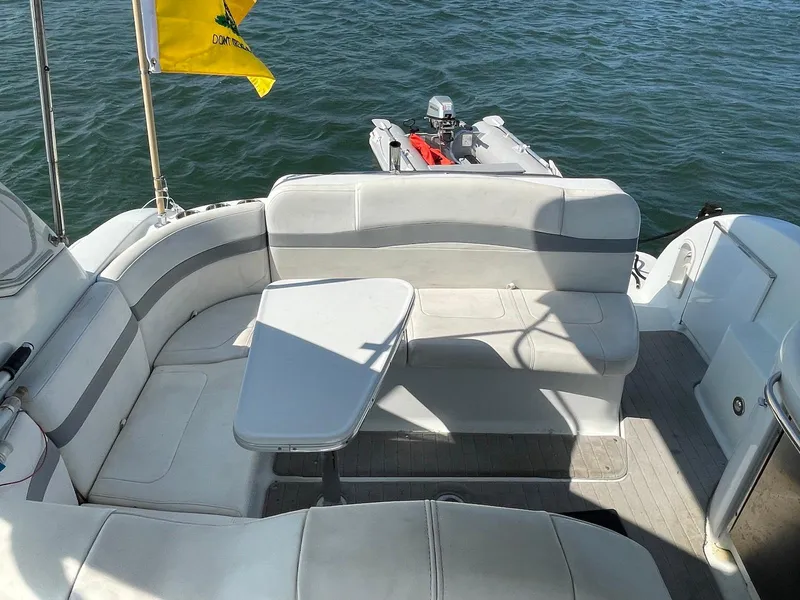 Slide: The Image of 2008 Formula 31 PC boat interior with seating, table, and water view. - 4