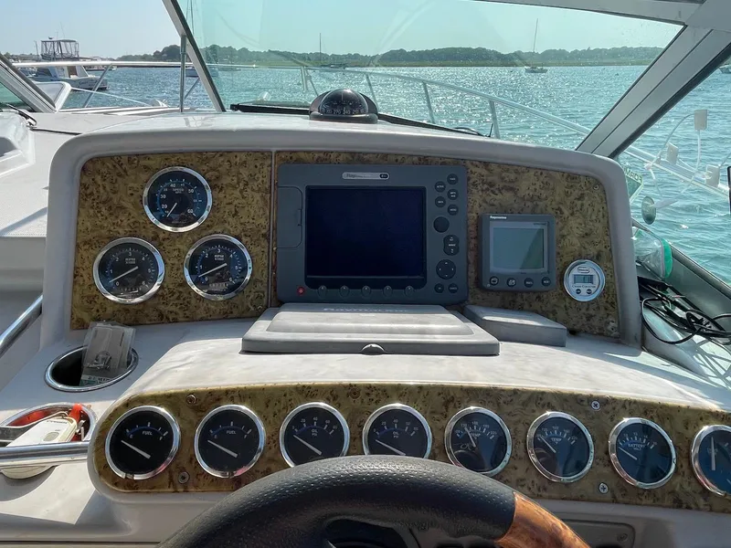 Slide: The Image of Dashboard of a 2008 Formula 31 PC boat with gauges and navigation equipment. - 6