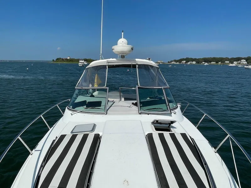 Slide: The Image of 2008 Formula 31 PC yacht on water, featuring striped sun pads and clear blue sky. - 9