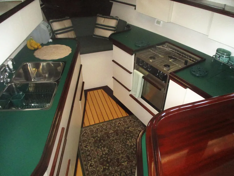 Slide: The Image of Interior of 1929 Gidley 52 Retro Modern Motor Yacht with kitchen and seating area. - 14