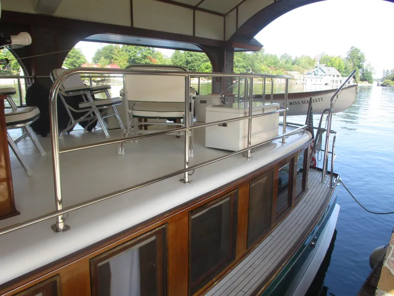 Slide: The Image of Vintage 1929 Gidley 52 Retro Modern Motor Yacht docked, featuring elegant wooden details and seating. - 23