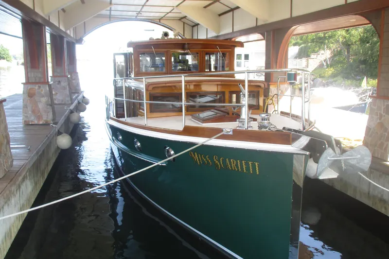 Slide: The Image of Vintage 1929 Gidley 52 Retro Modern Motor Yacht docked in a covered marina. - 26
