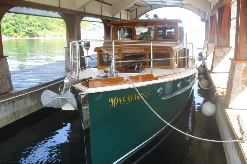 Slide: The Image of Vintage 1929 Gidley 52 Retro Modern Motor Yacht docked in a covered marina. - 27