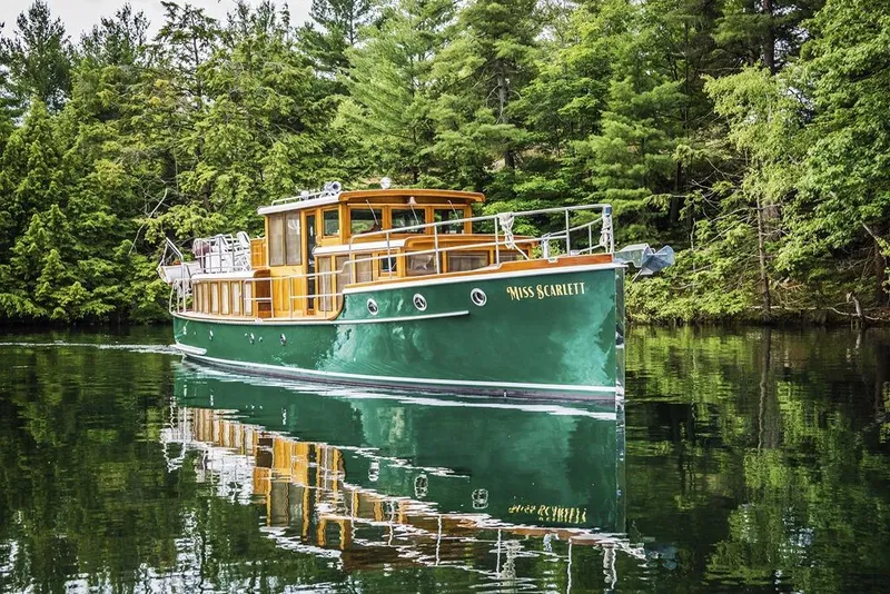 Slide: The Image of Vintage 1929 Gidley 52 Retro Modern Motor Yacht on serene forested lake. - 3