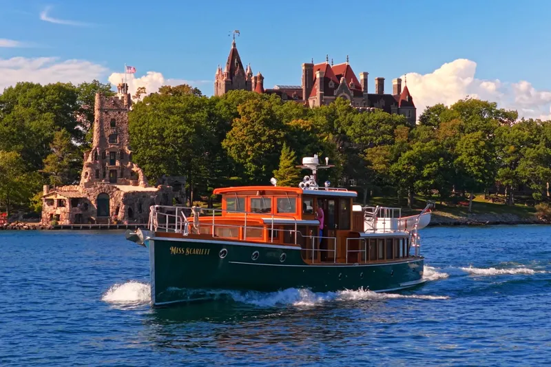 Slide: The Image of Vintage 1929 Gidley 52 Retro Modern Motor Yacht cruising near historic castle and lush greenery. - 30