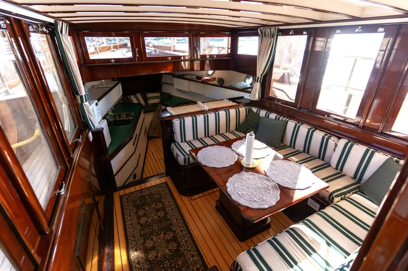 Slide: The Image of Interior of 1929 Vintage Gidley 52 Retro Modern Motor Yacht with striped seating and wooden finishes. - 35