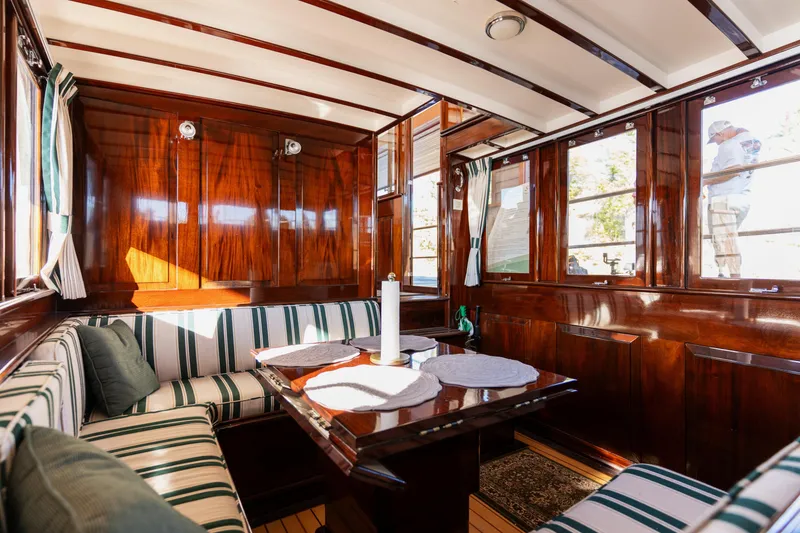 Slide: The Image of Interior of 1929 Vintage Gidley 52 Retro Modern Motor Yacht with polished wood and striped seating. - 37