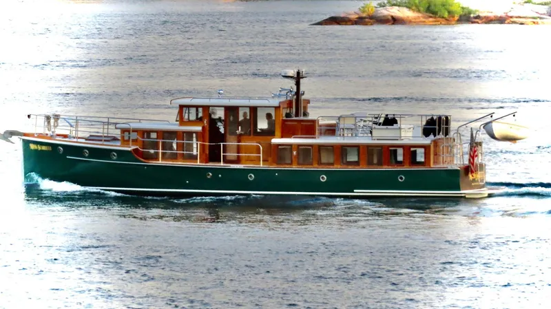 Slide: The Image of Vintage 1929 Gidley 52 Retro Modern Motor Yacht cruising on serene waters. - 5