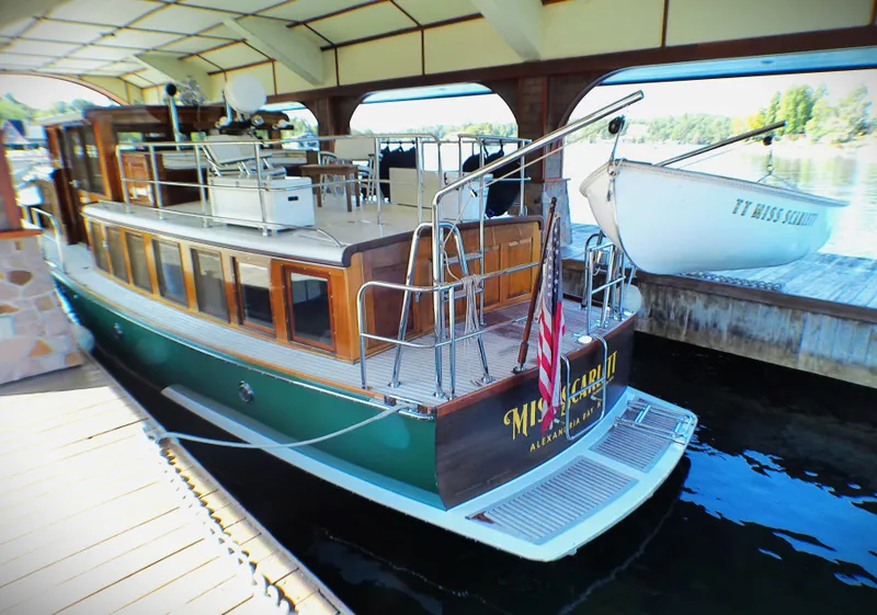 Slide: The Image of Vintage 1929 Gidley 52 Retro Modern Motor Yacht docked under a covered marina. - 8
