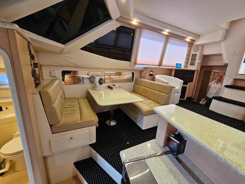 Slide: The Image of Interior of 2000 Carver 356 Aft Cabin Motor Yacht with dining area and modern amenities. - 19