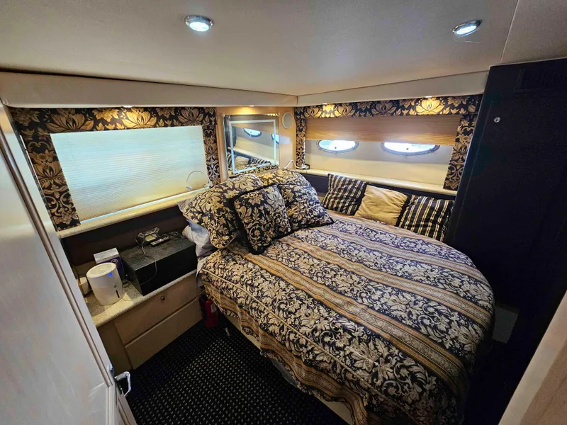 Slide: The Image of Luxurious bedroom in 2000 Carver 356 Aft Cabin Motor Yacht with elegant decor and cozy bedding. - 22