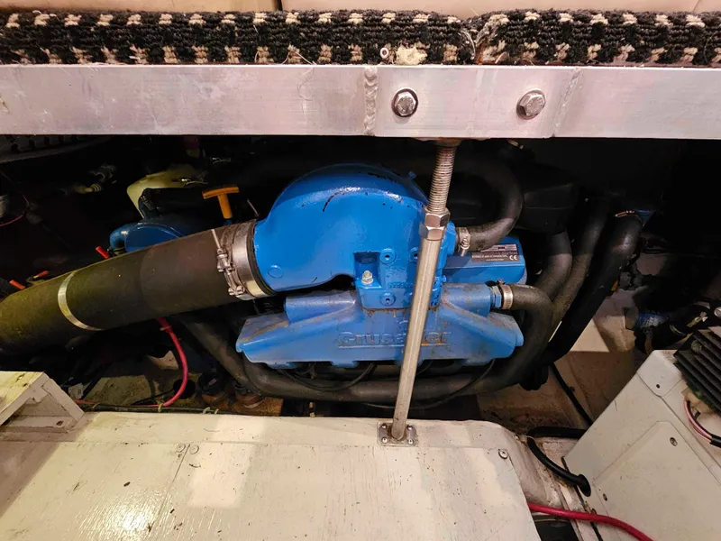 Slide: The Image of Engine compartment of a 2000 Carver 356 Aft Cabin Motor Yacht, featuring blue machinery. - 27