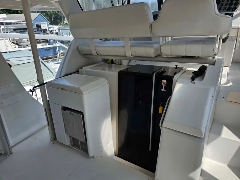 Slide: The Image of 2000 Carver 356 Aft Cabin Motor Yacht interior with seating and mini fridge. - 3
