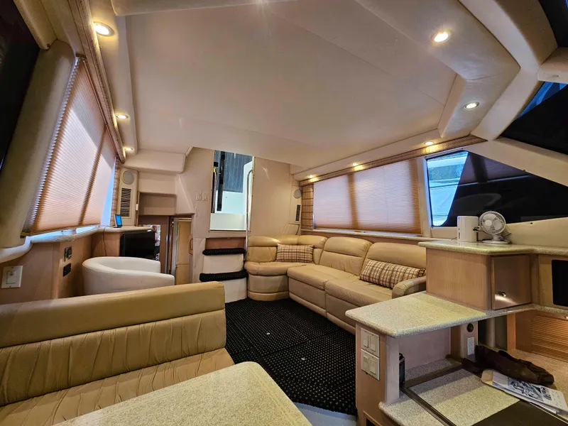 Slide: The Image of Luxurious interior of 2000 Carver 356 Aft Cabin Motor Yacht with plush seating. - 18