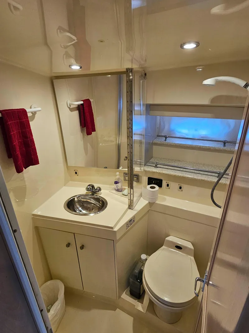 Slide: The Image of Bathroom interior of 2000 Carver 356 Aft Cabin Motor Yacht, featuring sink and toilet. - 26