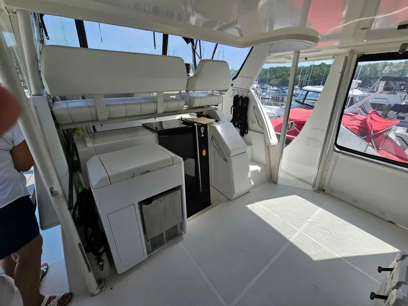 Slide: The Image of 2000 Carver 356 Aft Cabin Motor Yacht interior with seating and equipment. - 4