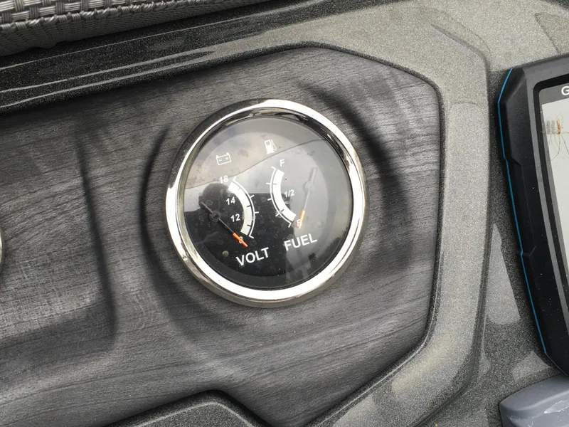 Slide: The Image of Gauge panel of 2022 Crest Classic LX 240 showing volt and fuel levels. - 11