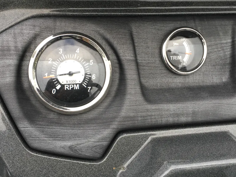 Slide: The Image of Dashboard of 2022 Crest Classic LX 240 with RPM and trim gauges. - 12