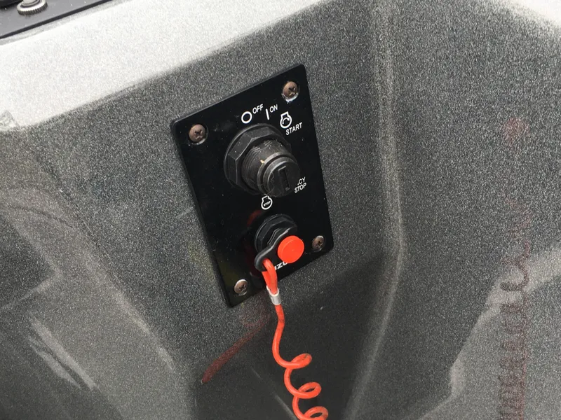 Slide: The Image of Control panel of 2022 Crest Classic LX 240 boat with ignition switch and safety lanyard. - 15