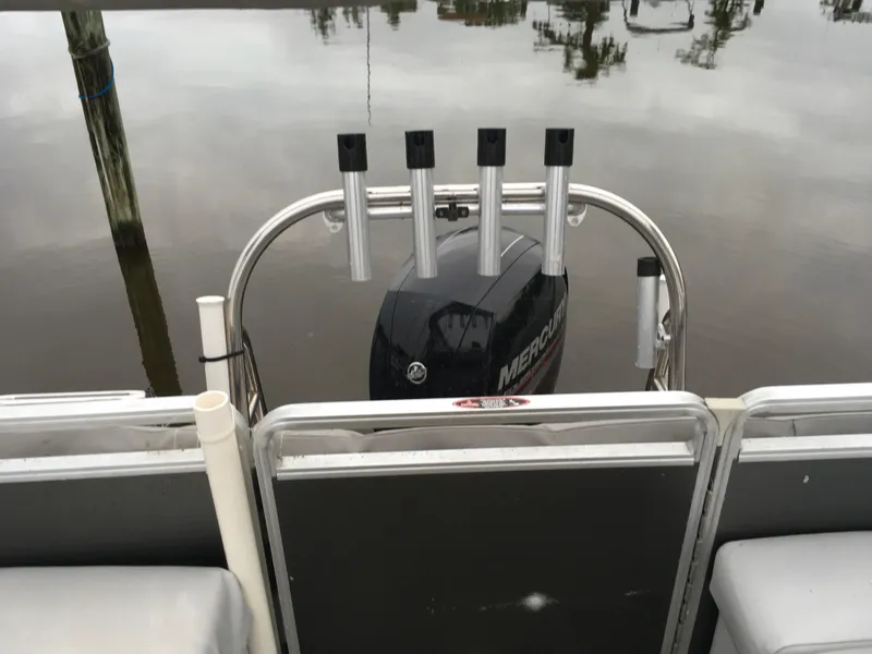 Slide: The Image of 2022 Crest Classic LX 240 boat with Mercury engine on calm water. - 26