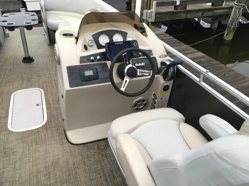 Slide: The Image of Control panel of 2022 Crest Classic LX 240 boat with ignition switch and safety lanyard. - 7