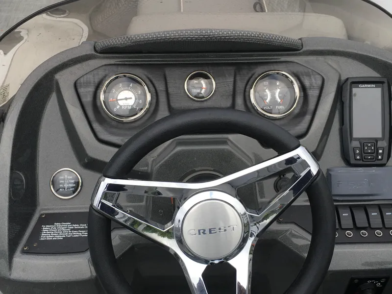 Slide: The Image of 2022 Crest Classic LX 240 dashboard with steering wheel and gauges. - 8