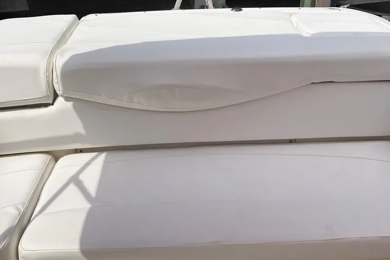 Slide: The Image of White seating area on a 2008 Maxum 1800SR boat, showcasing clean upholstery. - 22