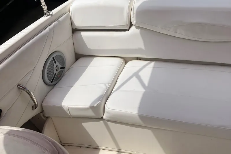 Slide: The Image of White leather seating on a 2008 Maxum 1800SR boat interior with speaker detail. - 23