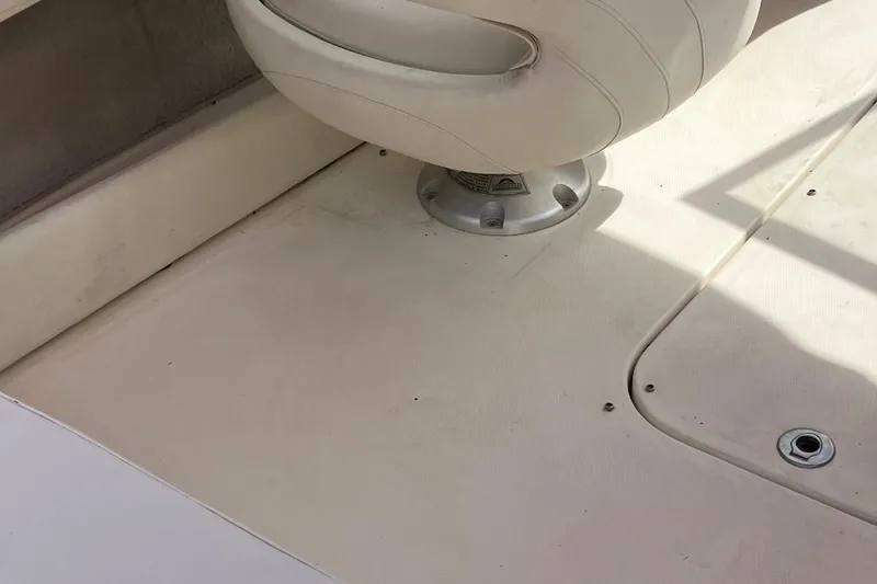 Slide: The Image of 2008 Maxum 1800SR boat interior with white seating and clean flooring. - 26