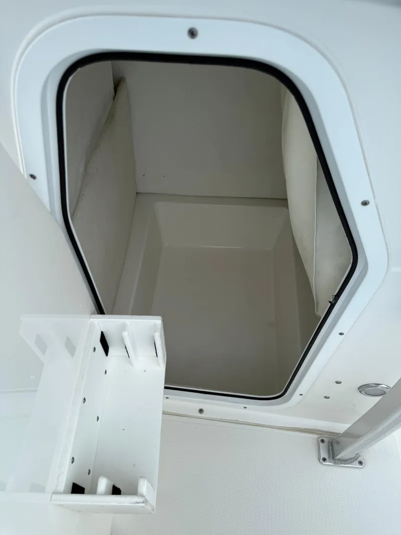 Slide: The Image of 2014 Sea Hunt Ultra 211 boat storage compartment with open hatch. - 11