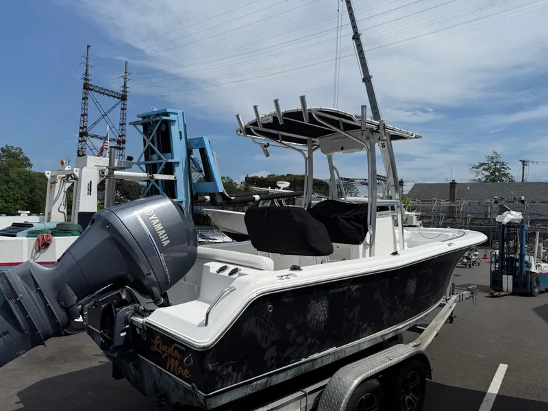 Slide: The Image of 2014 Sea Hunt Ultra 211 boat on trailer with Yamaha outboard motor. - 4
