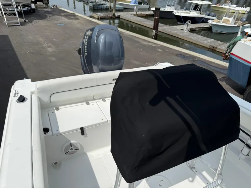 Slide: The Image of 2014 Sea Hunt Ultra 211 boat with Yamaha outboard motor at dock. - 6