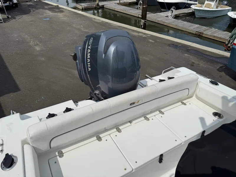 Slide: The Image of 2014 Sea Hunt Ultra 211 boat with Yamaha outboard motor at dock. - 7