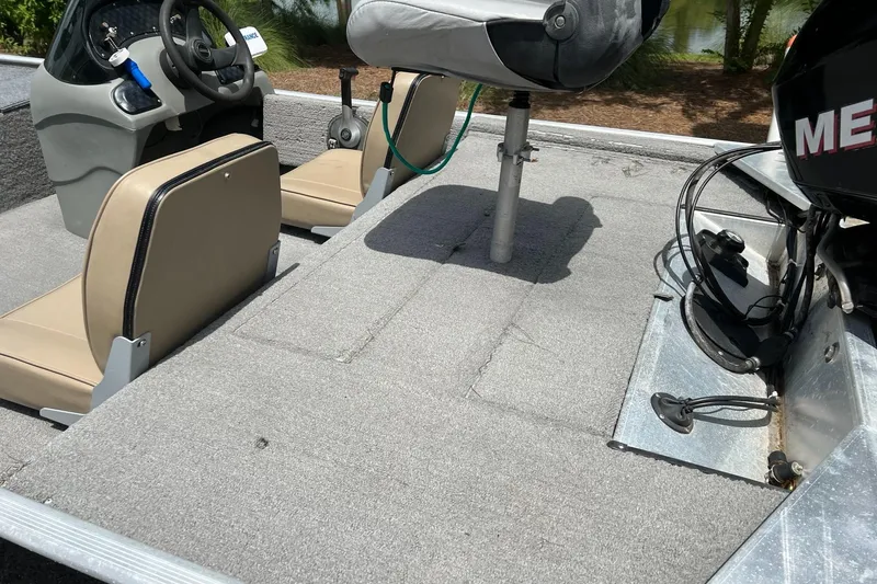 Slide: The Image of 2012 Tracker Pro165 boat interior with seats and steering wheel. - 5