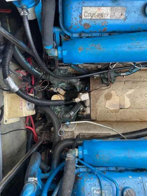 Slide: The Image of Engine compartment of a 1990 Tiara Yachts 31 Open, featuring blue Crusader engines. - 15