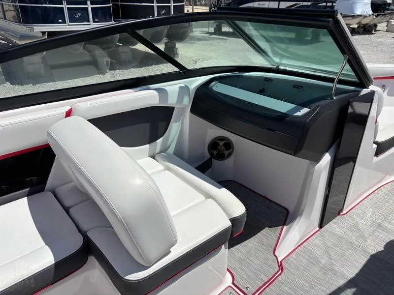 Slide: The Image of 2016 Regal 2000 ESX Bowrider interior with white seating and dashboard view. - 10