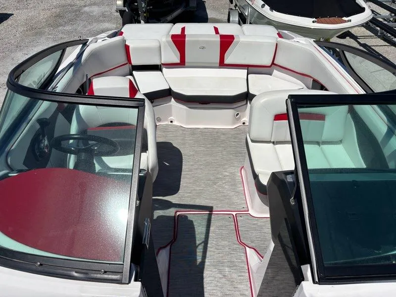 Slide: The Image of 2016 Regal 2000 ESX Bowrider interior with red and white seating, open cockpit view. - 7