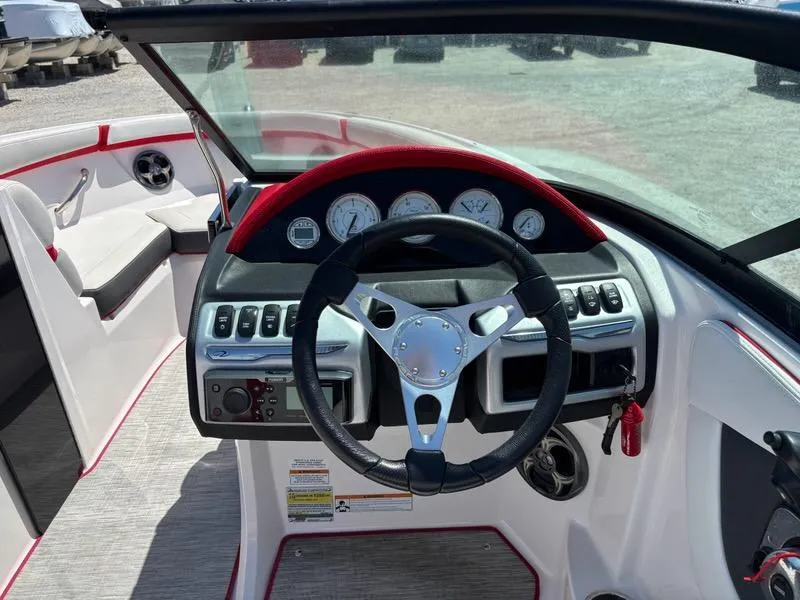Slide: The Image of 2016 Regal 2000 ESX Bowrider dashboard with steering wheel and gauges. - 9